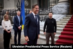 NATO Secretary-General Mark Rutte, middle, arrives for a meeting with Ukraine's President Volodymyr Zelenskyy, right, in Kyiv, Ukraine, Oct. 3, 2024. (Ukrainian Presidential Press Service/Handout via Reuters)