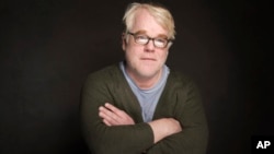 FILE - Philip Seymour Hoffman poses for a portrait during the Sundance Film Festival, in Park City, Utah, Jan. 19, 2014. 