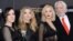 Actors, from left, Jena Malone, Natalie Dormer, Jennifer Lawrence and Donald Sutherland attend a special screening of "The Hunger Games: Mockingjay Part 2," Nov. 18, 2015, in New York. 