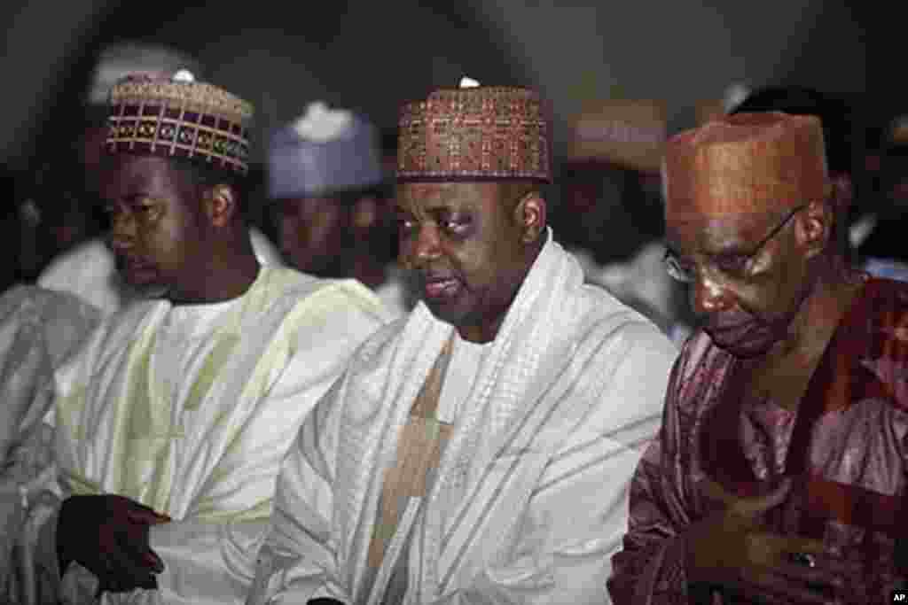 Nigeria's Vice President Namadi Sambo, center, offers prayers during Eid at the central mosque in Abuja, Nigeria, Aug. 30, 2011. AP