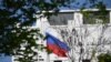 The Russian flag flies at the embassy's compound in Washington, D.C., on April 15, 2021. 