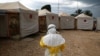 FILE PHOTO: A health worker wearing Ebola protection gear, prepares to enter the Biosecure Emergency Care Unit at the Alliance for International Medical Action ebola treatment center in Beni, DRC, March 30, 2019. 