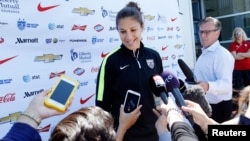 U.S. midfielder Carli Lloyd speaks to reporters before a training session for the round of eight in the FIFA 2015 women's World Cup soccer tournament at Algonquin College in Ottawa, Ontario, June 24, 2015.