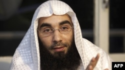 FILE - 'Sharia4Belgium' spokesman Fouad Belkacem speaks during a press conference in Sint-Jans-Molenbeek in Brussels, on June 1, 2012. 