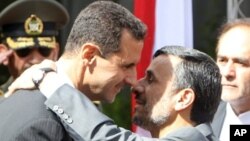 Serokê Sûrî Beşar El Esed û Serokê Îranî Mehmûd Ahmedînejad (erşîv). 