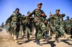 FILE - Afghan National Army soldiers march during a ceremony at a military base in the Guzara district of Herat province, Oct. 11, 2020. (AFP)