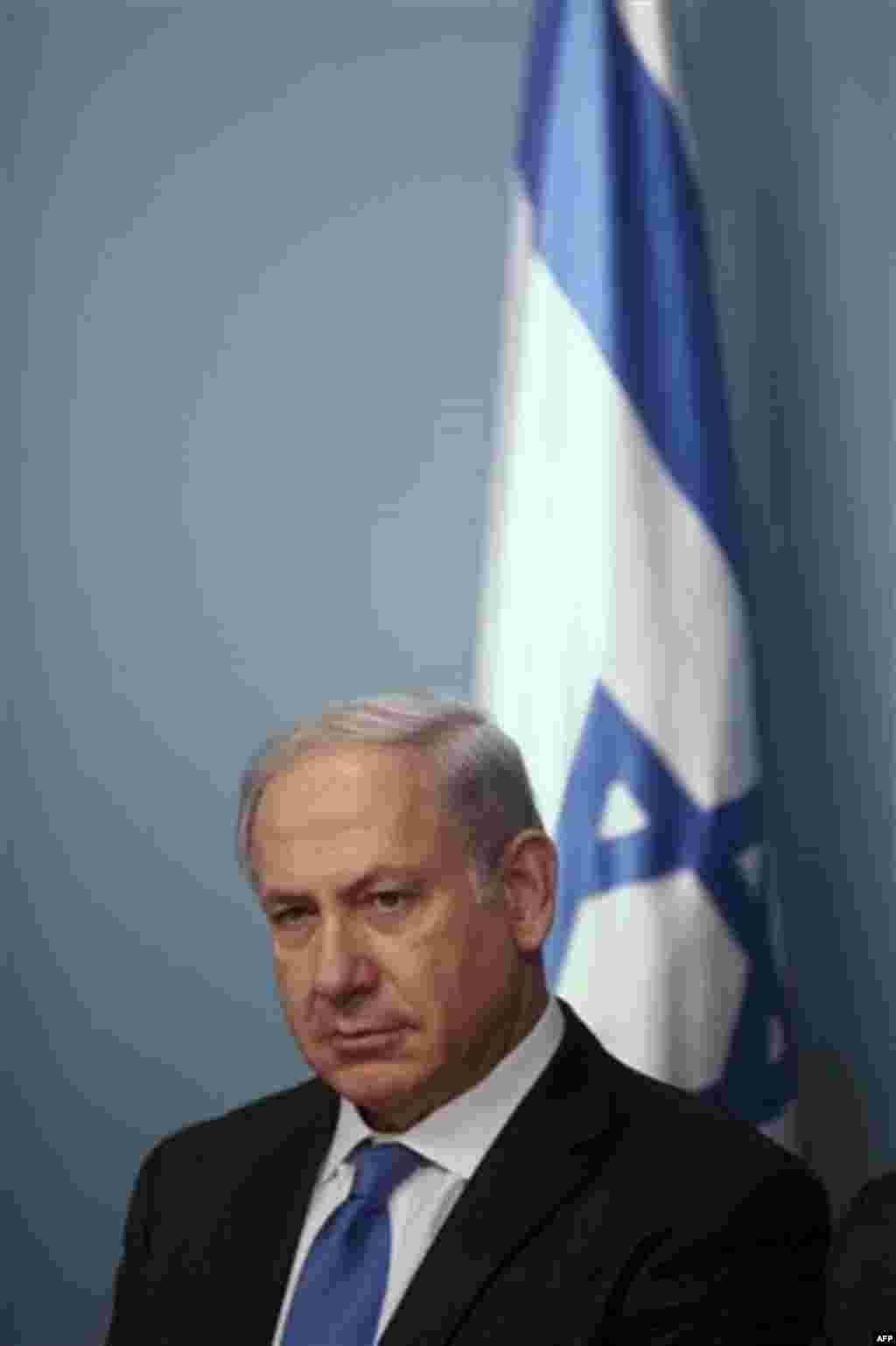 Israeli Prime Minister Benjamin Netanyahu listens during a press conference in Jerusalem, Monday, Nov. 15, 2010. Israel would be allowed to finish hundreds of apartments already under construction in West Bank settlements even if it agrees to a U.S.-draft