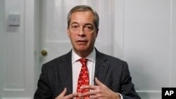 Former UK Independence Party (UKIP) leader Nigel Farage gestures during an interview with The Associated Press in London, Nov. 29, 2016.