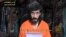 In this undated image from a video posted on Islamic militant websites and made available on June 9, 2010, a man identified as French security agent Denis Allex pleads for his release from the Somali militant group al-Shabab.