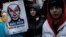 Ukrainians living in Turkey hold a protest against Russia's military operation in Ukraine, in front of the Russian Consulate in Istanbul, Turkey, Feb. 24, 2022.