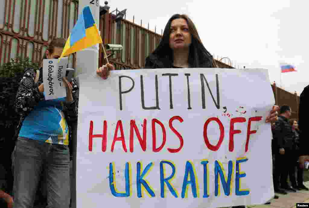 Ukrainians living in Cyprus take part in an anti-war protest in front of the Russian embassy after Russian President Vladimir Putin authorized a military operation in eastern Ukraine, in Nicosia, Cyprus, Feb. 24, 2022.