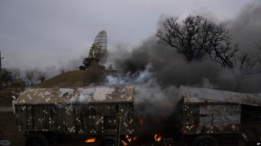 Smoke rise from an air defence base in the aftermath of an apparent Russian strike in Mariupol, Ukraine, Feb. 24, 2022. Big explosions were heard before dawn in Kyiv, Kharkiv and Odesa as world leaders decried the start of Russian invasion (AP Photo/Evgeniy Maloletka)
