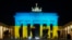 The Brandenburg Gate in Berlin, Germany, is illuminated in the colors of the Ukrainian flag to show solidarity with the country as Russia launches a military operation, Feb. 23, 2022.