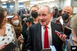 FILE - Senate Foreign Relations Committee Ranking Member Jim Risch, R-Idaho, speaks to reporters, at the Capitol in Washington, Feb. 15, 2022.
