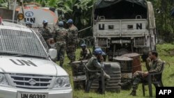 FILE - Peacekeepers rest after the installation of a new base in Rugari, 50 km from the city of Goma in the east of the Democratic Republic of Congo, Jan. 28, 2022.