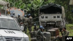 FILE - Peacekeepers rest after the installation of a new base in Rugari, 50 km from the city of Goma in the east of the Democratic Republic of Congo, Jan. 28, 2022.