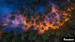 FILE - An aerial view shows a forest fire in Krasnoyarsk Region, in Siberia, Russia July 17, 2020. (Julia Petrenko/Greenpeace/Handout via Reuters)