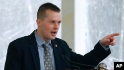 FILE - In this April 27, 2019, file photo, U.S. Rep. Jared Golden, D-Maine, speaks during a ceremony for a Zumwalt-class guided missile destroyer named for former President Lyndon Baines Johnson in Bath, Maine.