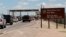 FILE - Cars wait to enter Fort Bliss in El Paso, Texas. 