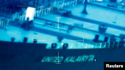 A image from video taken by the U.S. Coast Guard shows the oil tanker United Kalavyrta (also known as the United Kalavrvta), which is carrying a cargo of disputed Kurdish crude oil, approaching Galveston, Texas, July 25, 2014.