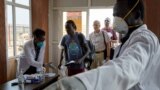 FILE - Passengers from an international flight are given a temperature screening at Juba International Airport in Juba, South Sudan, Jan. 31, 2020. 