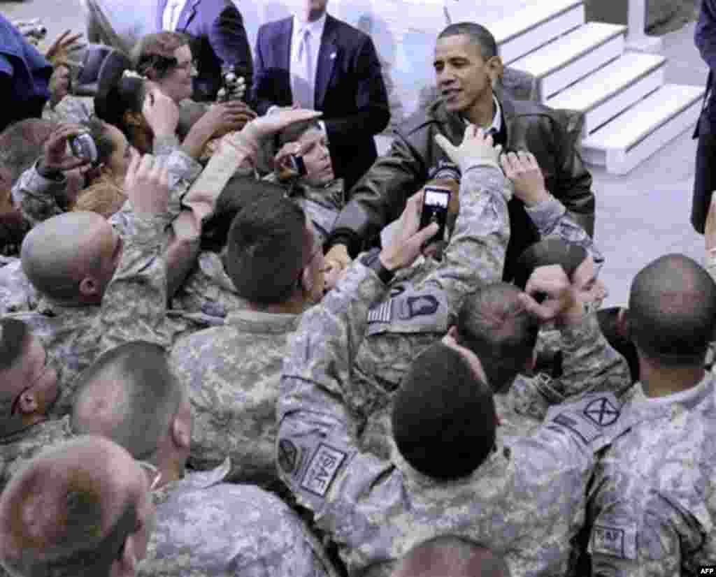 President Barack Obama greets troops at a rally during an unannounced visit at Bagram Air Field in Afghanistan, Friday, Dec. 3, 2010. (AP Photo/Pablo Martinez Monsivais)