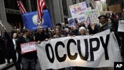 Occupy Wall Street protesters march through lower Manhattan in New York, Thursday, Nov. 17, 2011. Two days after the encampment that sparked the global Occupy protest movement was cleared by authorities, demonstrators marched through New York's financial 