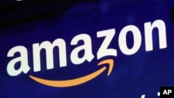 FILE - In this July 27, 2018 file photo, the logo for Amazon is displayed on a screen at the Nasdaq MarketSite. 