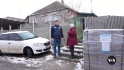 In Ukraine's Kharkiv region, aid workers risk lives to keep residents warm