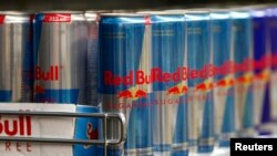 Red Bull drink cans are seen in a supermarket in Vienna March 14, 2013. 