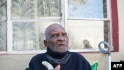 FILE - Fredie Blom celebrates his 116th birthday at his home in Delft, near Cape Town, South Africa, May 8, 2020.