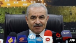 Palestinian Prime Minister Mohammad Shtayyeh addresses a cabinet meeting during which he announced his government's resignation and called for "new political measures" in Ramallah on February 26, 2024, amid the ongoing war in the Gaza Strip.