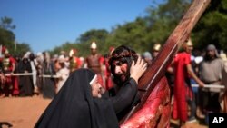 FILE—Actors perform in a Way of the Cross reenactment as part of Holy Week celebrations, in Atyra, Paraguay, March 29, 2024.