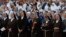 FILE - Nuns attend a mass at Saint John's Lateran Basilica in Rome, Italy, June 4, 2015. 