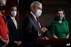 FILE - House Budget Committee Chairman John Yarmuth, D-Ky., speaks with reporters before the House votes to pass a $1.9 trillion pandemic relief package, during a news conference at the Capitol in Washington, Feb. 26, 2021.