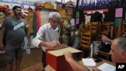 A man voters in the presidential run-off election in Canelones, Uruguay, Nov. 24, 2024. 