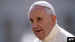 Pope Francis arrives in St. Peter's square for his weekly general audience, at the Vatican in Rome, Sept. 9, 2015.