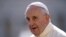 FILE - Pope Francis arrives in St. Peter's square at the Vatican for his weekly general audience, Sept. 9, 2015.