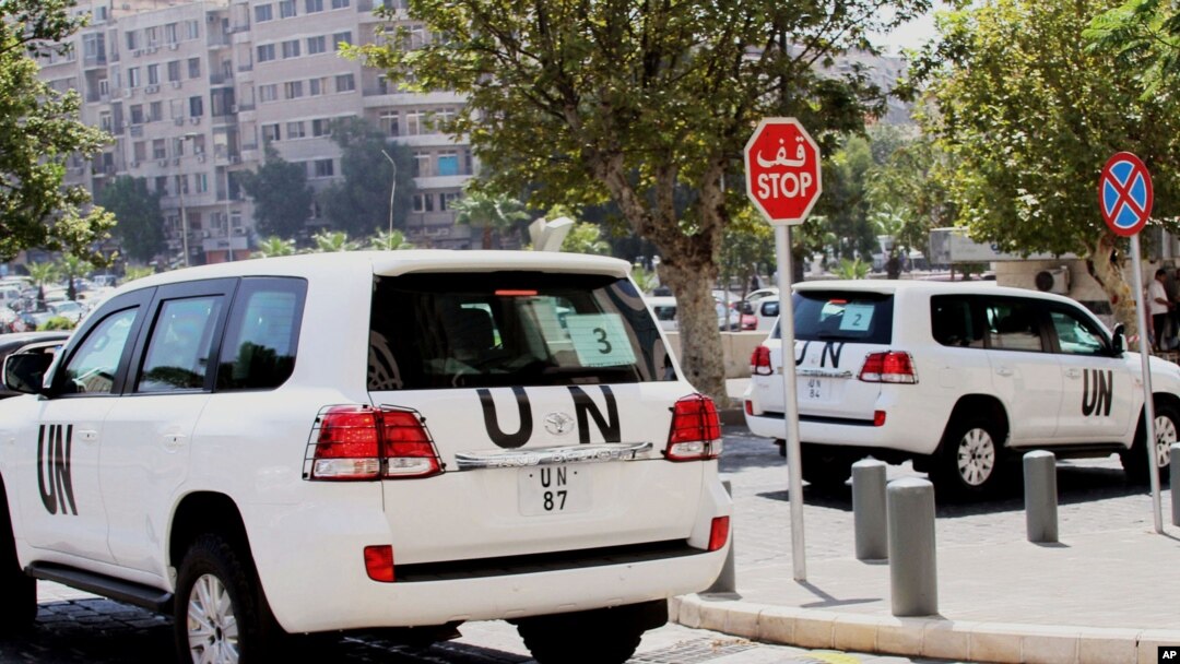 Vehículos de la ONU en las calles de Damasco; En Sriria se usó gas sarín.