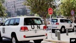 Vehículos de la ONU en las calles de Damasco; En Sriria se usó gas sarín.