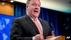 FILE - Secretary of State Mike Pompeo speaks to reporters at a news conference at the State Department in Washington.