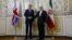 Britain's Foreign Secretary Philip Hammond (L) shakes hands with Iran's Foreign Minister Mohammad Javad Zarif before a meeting at the Ministry of Foreign Affairs in Tehran, Iran, Aug. 23, 2015. 