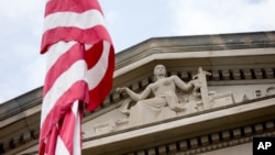 FILE - The front facade of the Robert F. Kennedy Department of Justice Building is seen in Washington, in a June 19, 2015, photo.