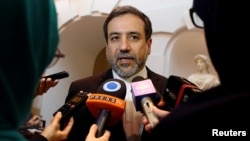 FILE - Iran's top nuclear negotiator, Abbas Araqchi, talks to journalists in Vienna, Austria, Oct. 19, 2015. 