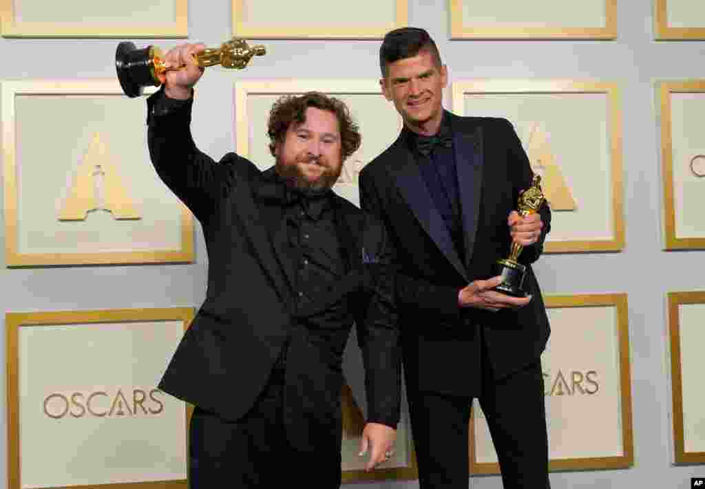 Michael Govier, left, and Will McCormack pose in the press room with the award for best animated short film for &quot;If Anything Happens I Love You&quot; at the Oscars on Sunday, April 25, 2021, at Union Station in Los Angeles. (AP Photo/Chris Pizzello, Pool)