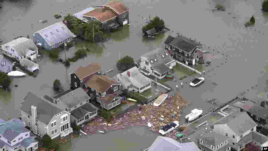 This photo made available by the New Jersey Governor's Office shows flooding and damage in Seaside, N.J. on Oct. 30, 2012.