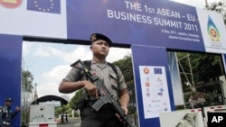 An armed police officer stands guard outside the venue of the 18th ASEAN Summit - will be held on May 7-8 in Jakarta, Indonesia, May 4, 2011