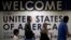 FILE - International passengers arrive at Washington Dulles International Airport.