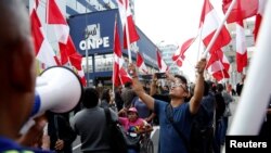 FILE - Supporters of Peruvian presidential candidate Pedro Pablo Kuczynski shout slogans outside Peru's National Office of Electoral Processes (ONPE) in Lima, Peru, June 7, 2016. 