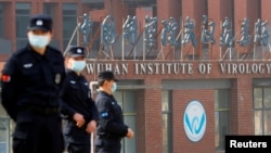 FILE - Security personnel keeps watch outside the Wuhan Institute of Virology during the visit by the World Health Organization (WHO) team tasked with investigating the origins of the coronavirus disease (COVID-19), in Wuhan, Hubei province, China February 3, 2021. (REUTERS)